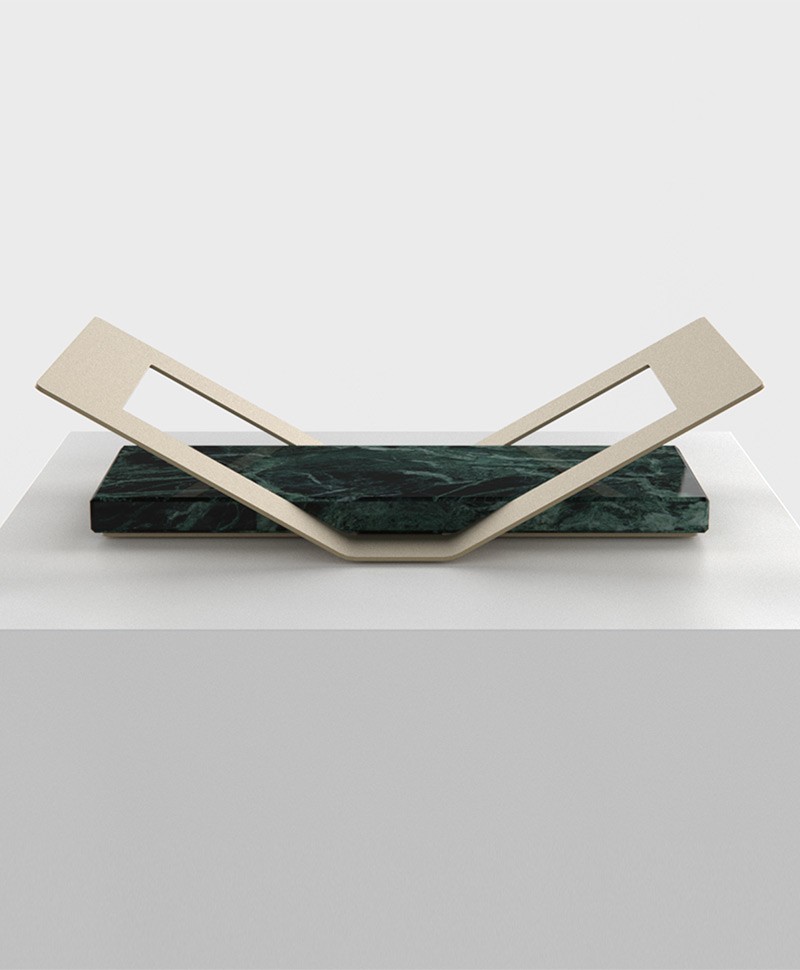 Hier sehen Sie ein Bild des grünen BOOK STAND Buchständer aus Marmor und Stahl von Fold Furniture im RAUM concept store.
