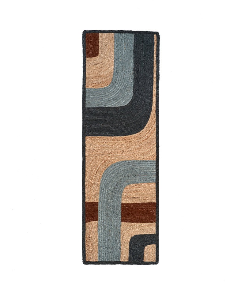 Das Produktbild zeigt den langen Teppich Penny Lane in der Farbe Nouage von Élitis im RAUM concept store