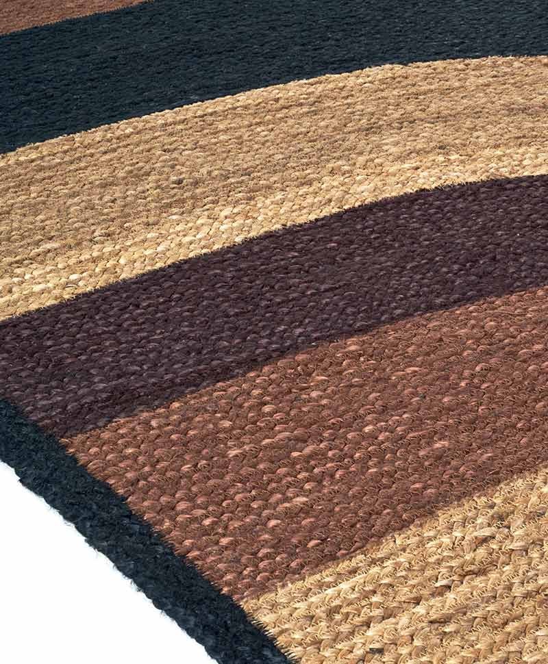 Das Produktbild zeigt eine Nahaufnahme des Teppich Penny Lane in der Farbe Argile von Élitis im RAUM concept store