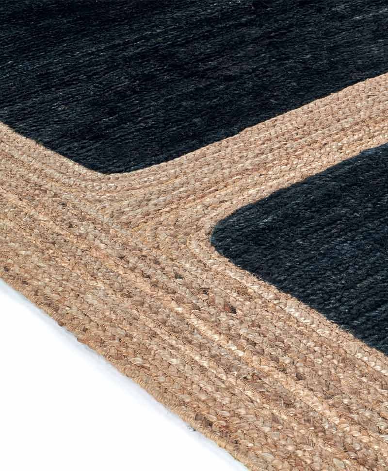 Das Produktbild zeigt eine Nahaufnahme des Jute Teppich Jude in der Farbe Graphite von Élitis im RAUM concept store