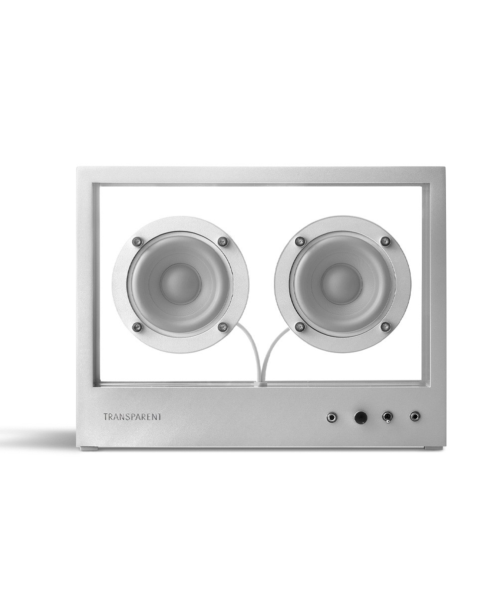 Hier ist ein Produktfoto des kleinen Transparent Speakers in der Farbe Metal (grau) von der Marke Transparent Sound zu sehen – im Onlineshop RAUM concept store