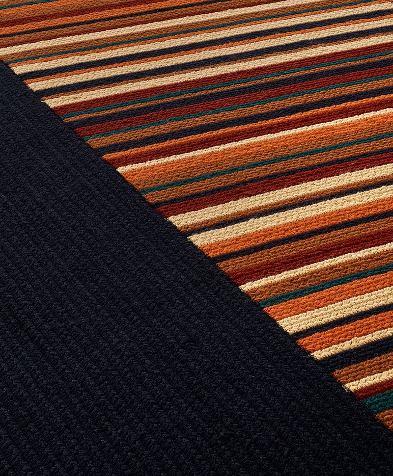 Das Produktbild zeigt eine Nahaufnahme des Outdoor Teppich Abbey Road in der Farbe Havane von Élitis im RAUM concept store