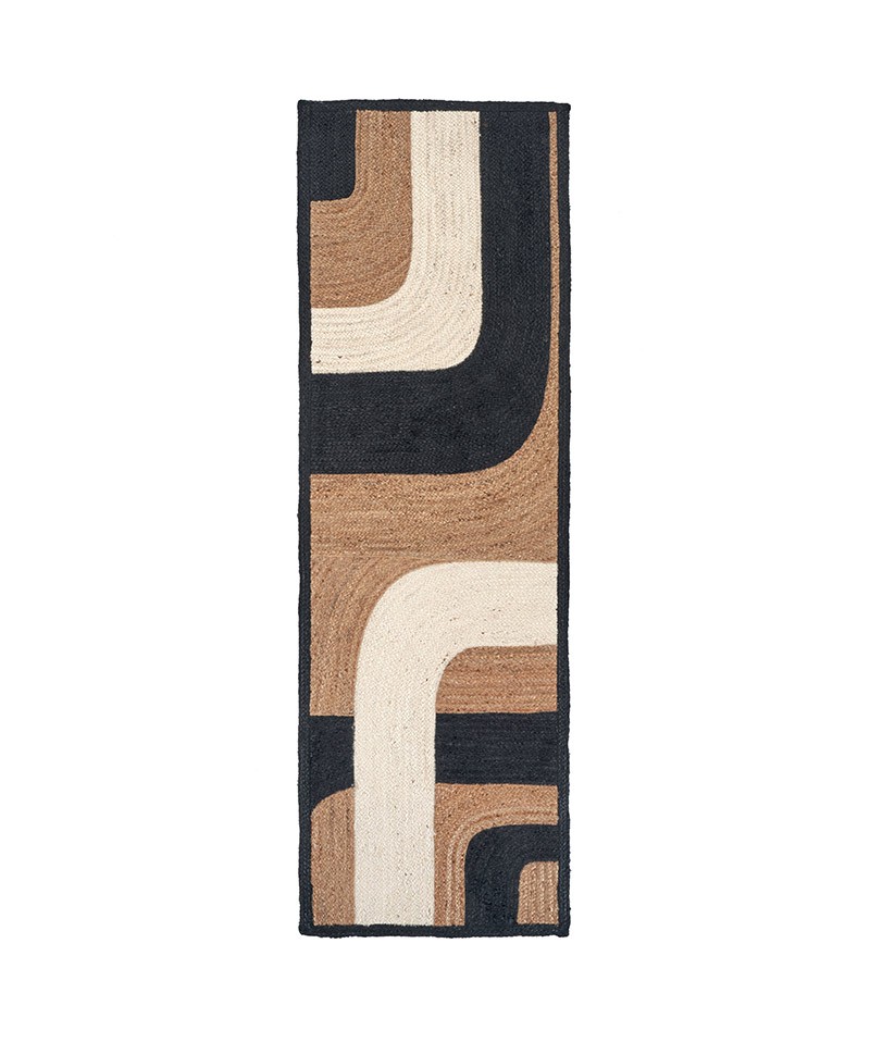 Das Produktbild zeigt den langen Teppich Penny Lane in der Farbe Black and White von Élitis im RAUM concept store