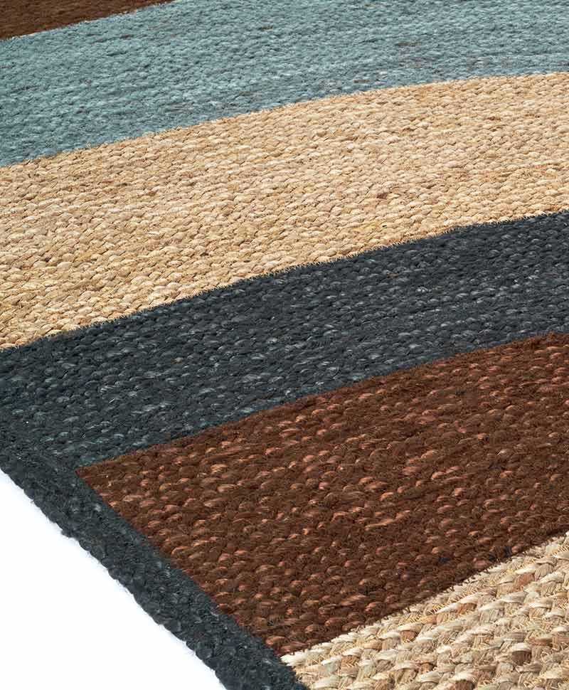 Das Produktbild zeigt eine Nahaufnahme des Teppich Penny Lane in der Farbe Nuage von Élitis im RAUM concept store